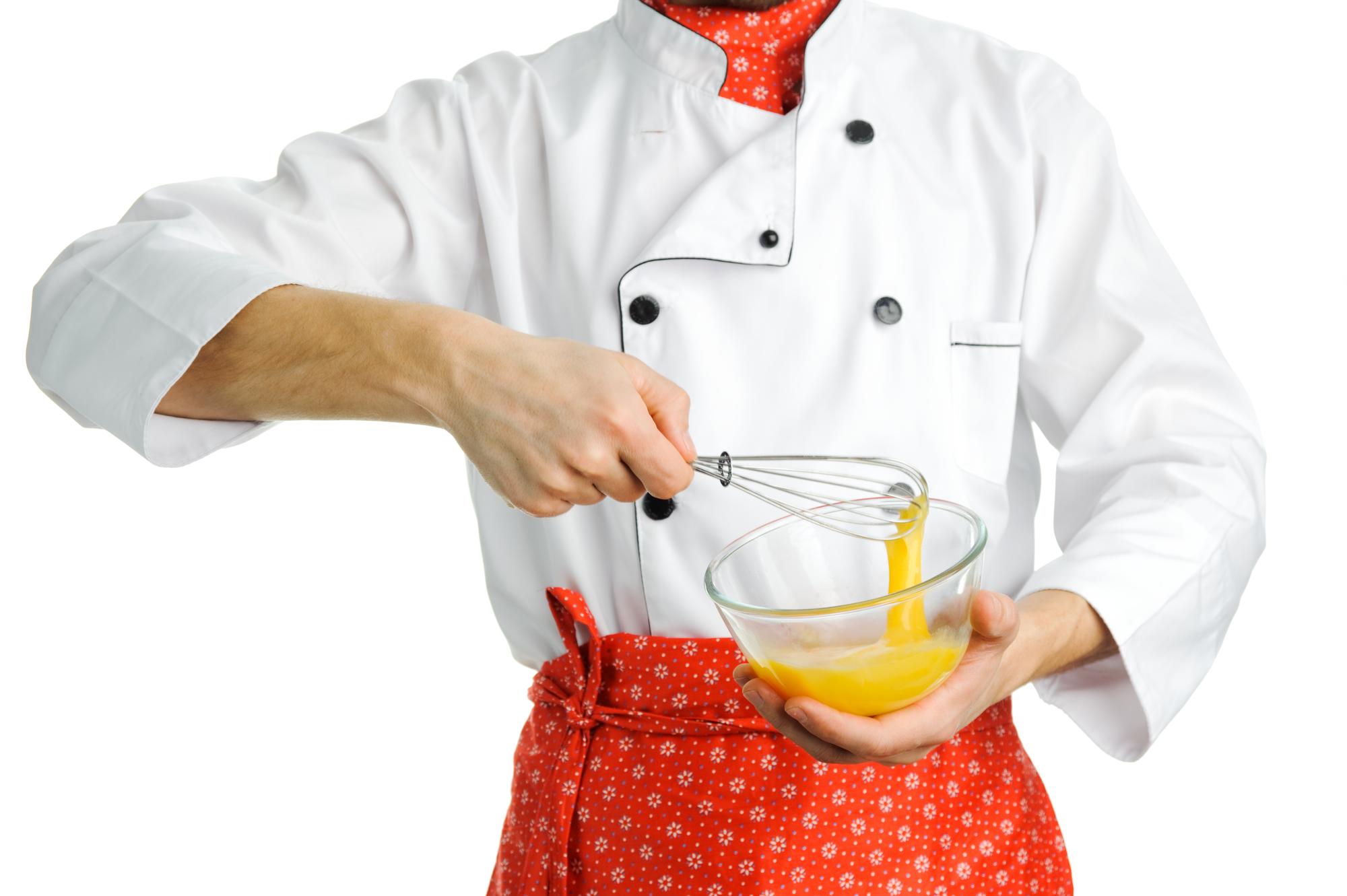 Assistant chef preparing garnish